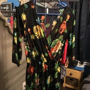 Floral lined long sleeve short romper.